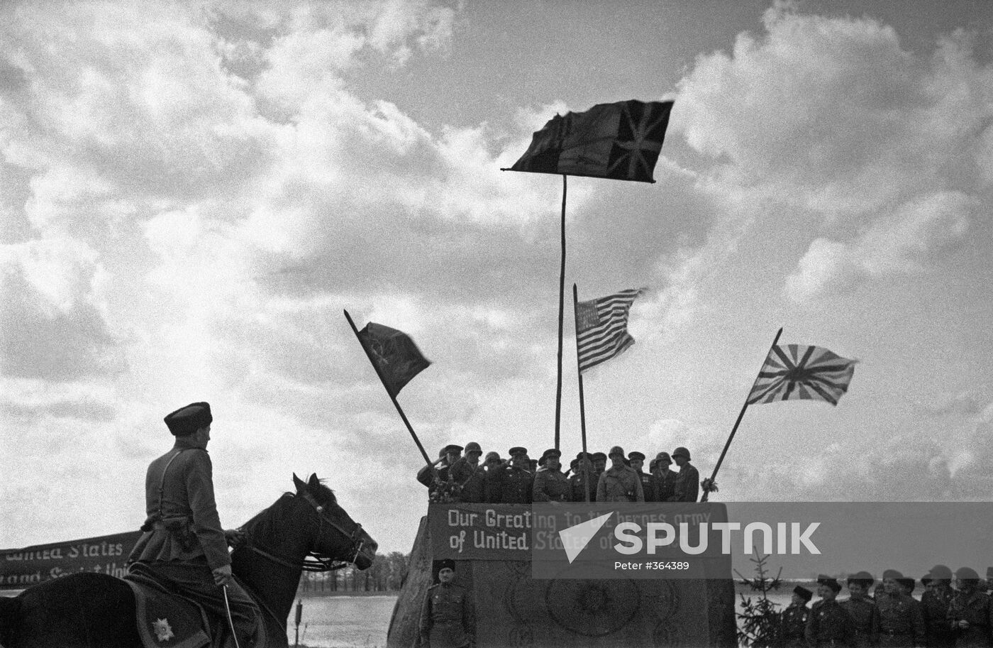 Soviet and American troops meet on the River Elbe