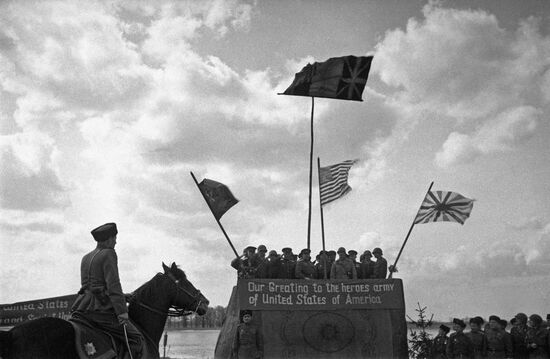 Soviet and American troops meet on the River Elbe