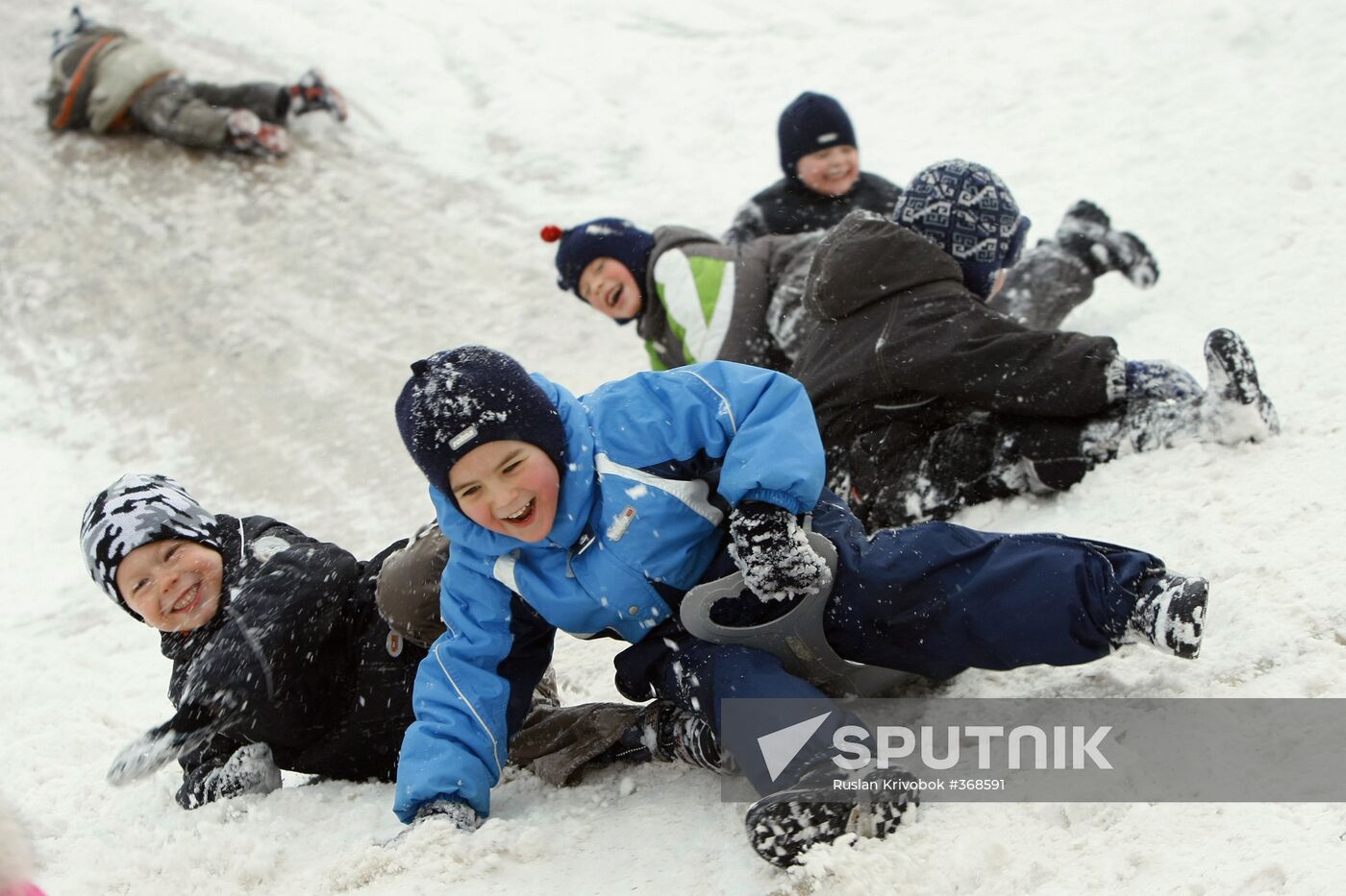 Children ice sliding in Moscow