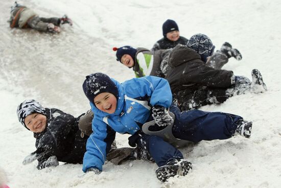 Children ice sliding in Moscow