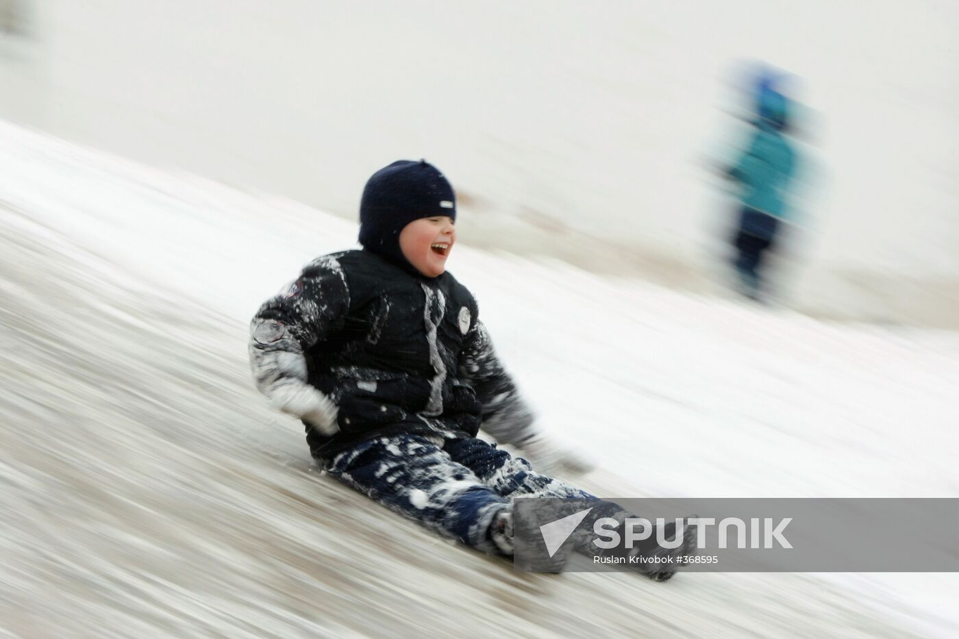 Children ice sliding in Moscow