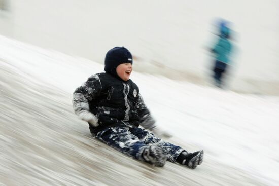 Children ice sliding in Moscow