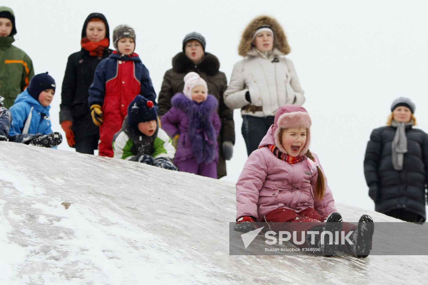 Children ice sliding in Moscow