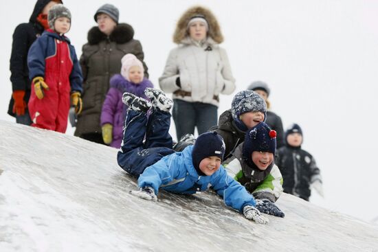 Children ice sliding in Moscow