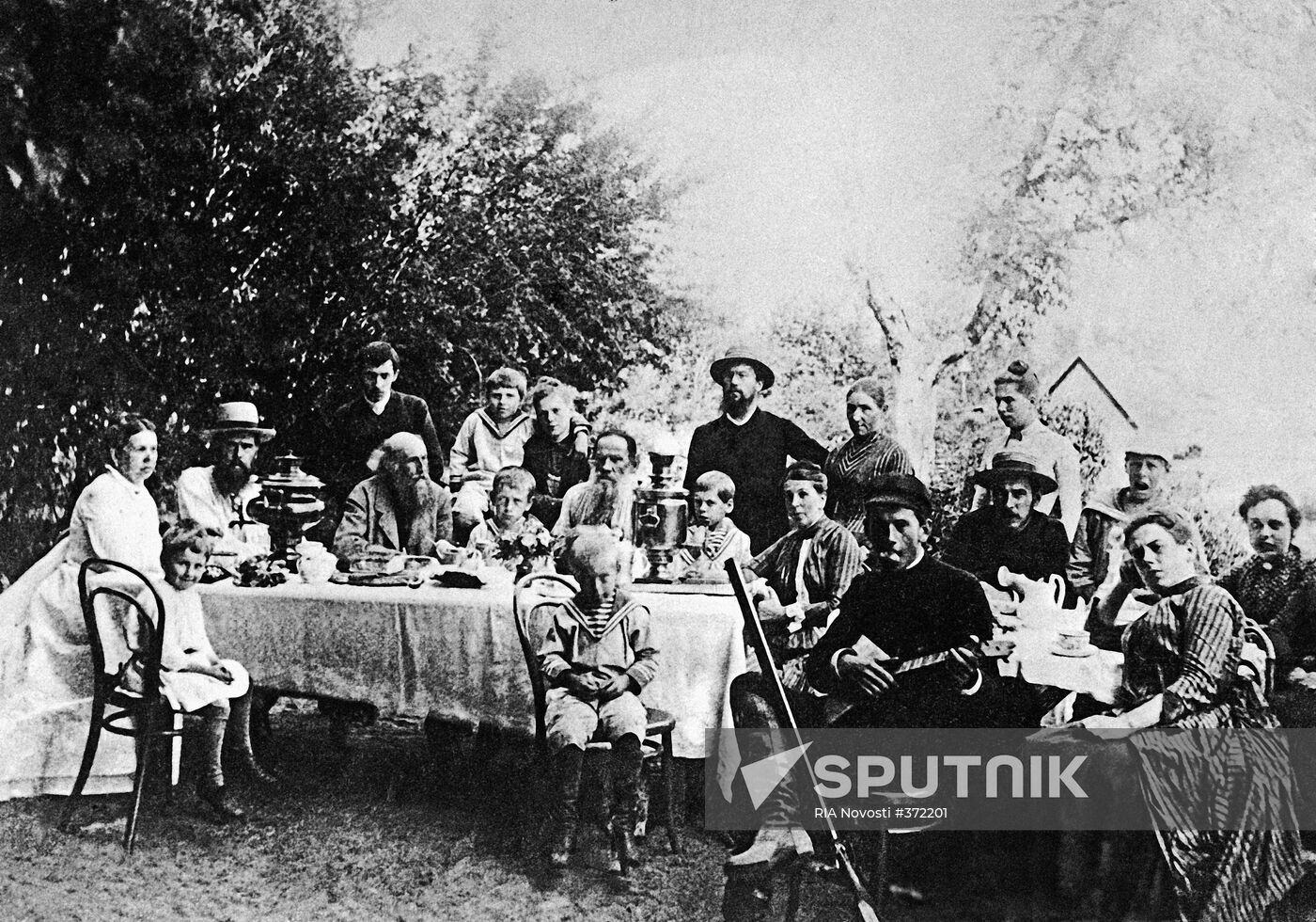 Leo Tolstoy amid family members and friends