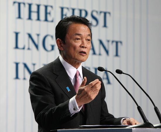 Taro Aso at a liquefied natural gas plant