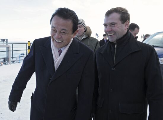 Dmitry Medvedev and Taro Aso examine Grand Aniva tanker