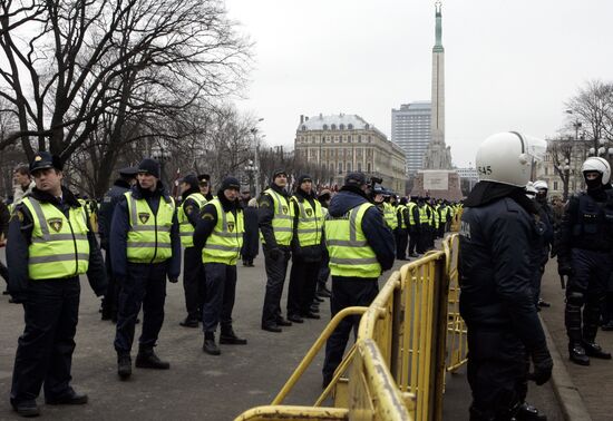 Waffen SS legionnaires and their supporters marching in Riga