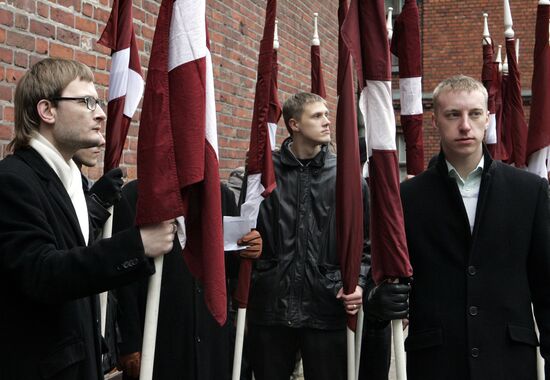 Waffen SS legionnaires and their supporters marching in Riga