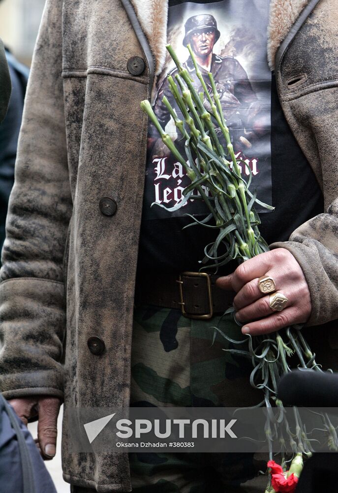 Waffen SS legionnaires and their supporters marching in Riga