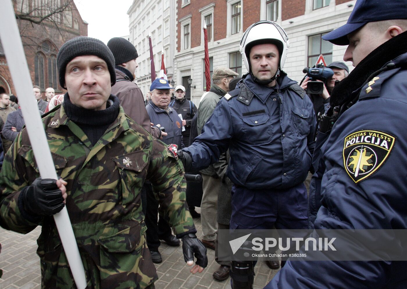 Waffen SS legionnaires and their supporters marching in Riga