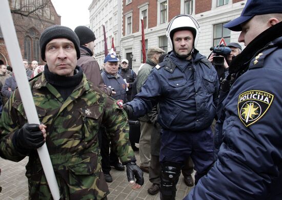 Waffen SS legionnaires and their supporters marching in Riga