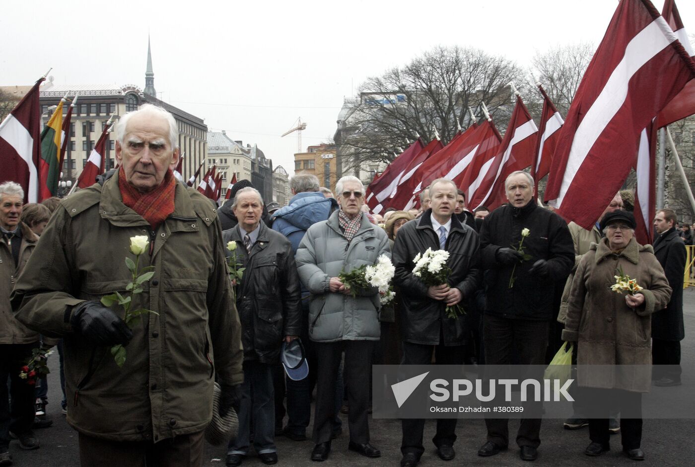 Waffen SS legionnaires and their supporters marching in Riga