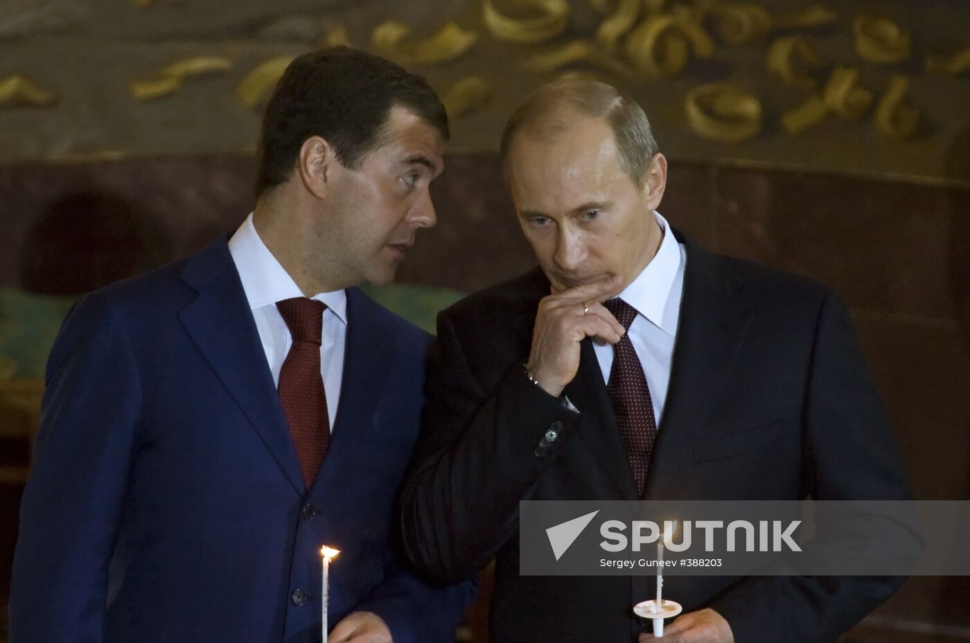 Dmitry Medvedev and Vladimir Putin attending Easter service