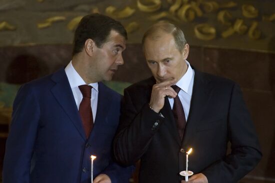 Dmitry Medvedev and Vladimir Putin attending Easter service