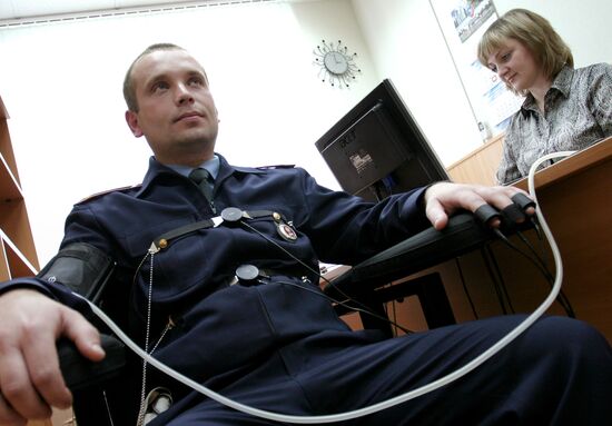 Police officers undergoing lie-detector test