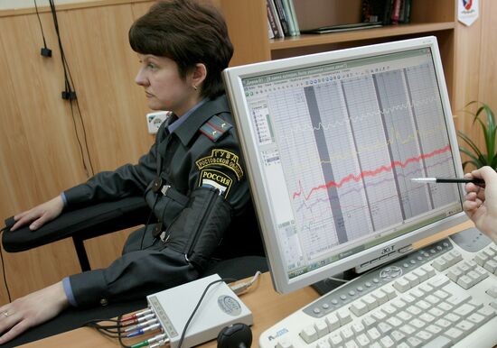 Police officers undergoing lie-detector test