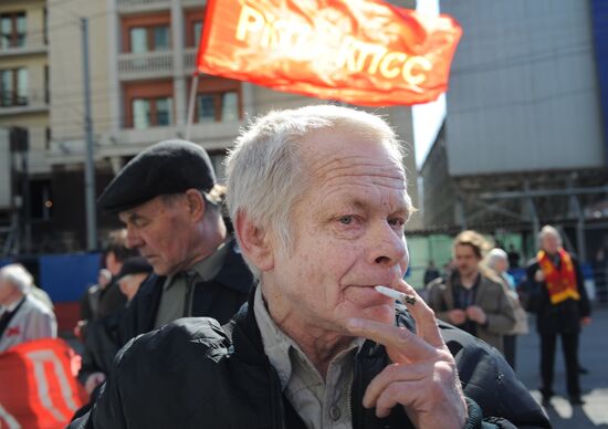 Communist Party supporters hold Labor Day march