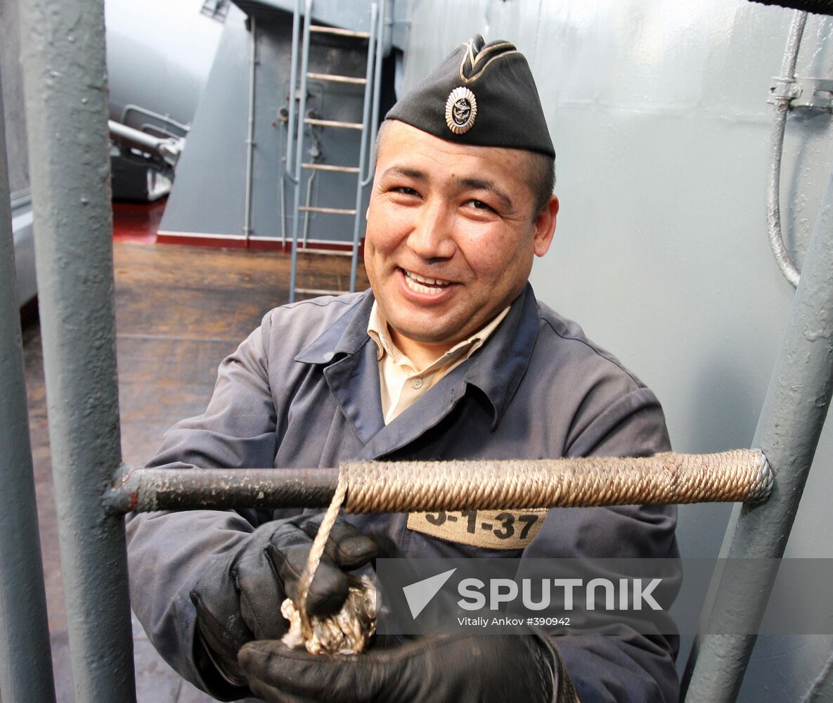 Sailors cleaning up Varyag missile cruiser