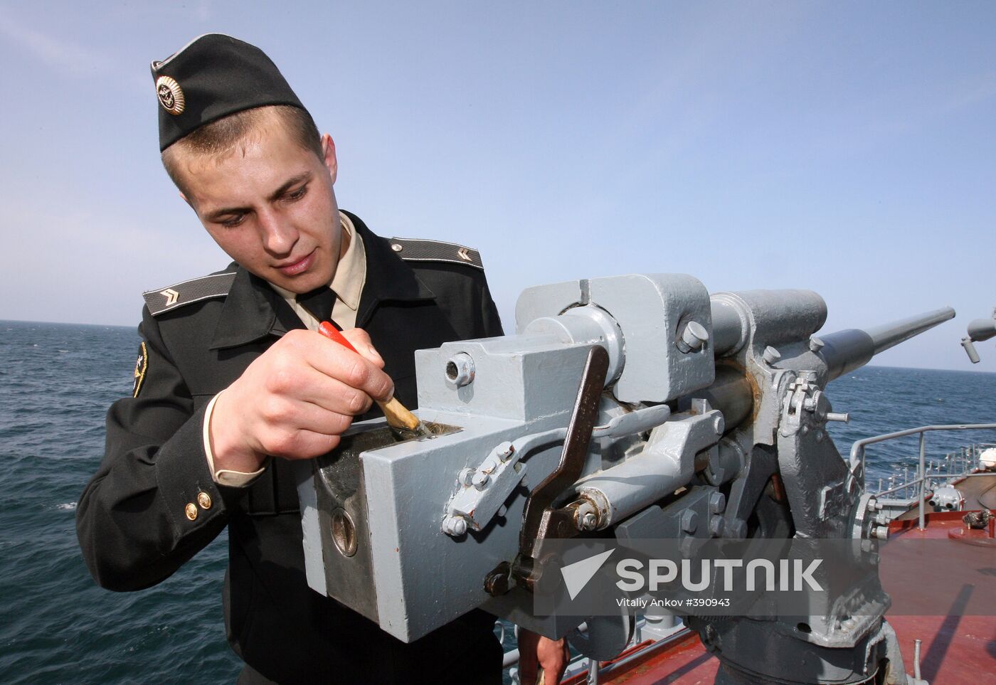 Sailors cleaning up Varyag missile cruiser