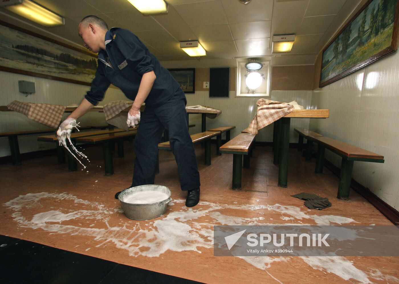 Sailors cleaning up Varyag missile cruiser