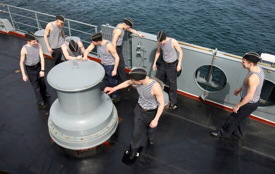 Sailors cleaning up Varyag missile cruiser