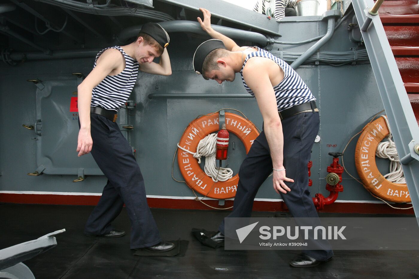 Sailors cleaning up Varyag missile cruiser