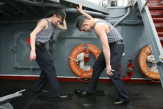 Sailors cleaning up Varyag missile cruiser