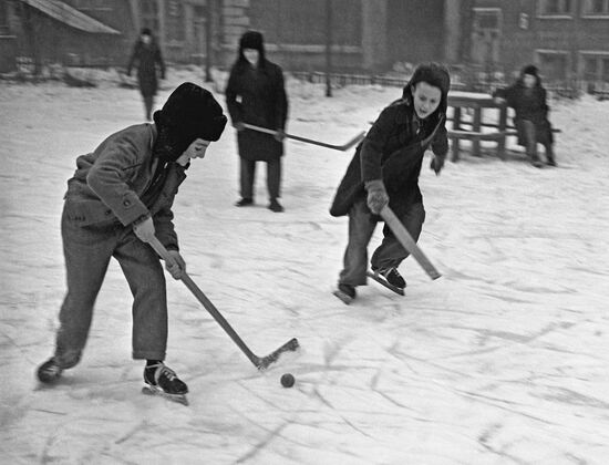Playing hockey at a Moscow backyard