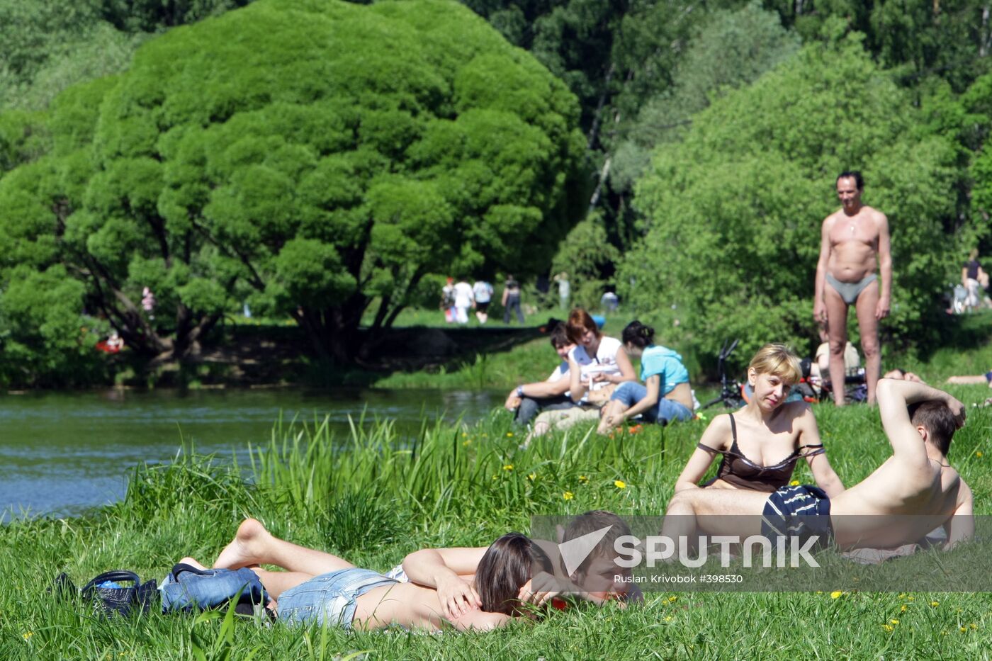 Muscovites resting outdoors