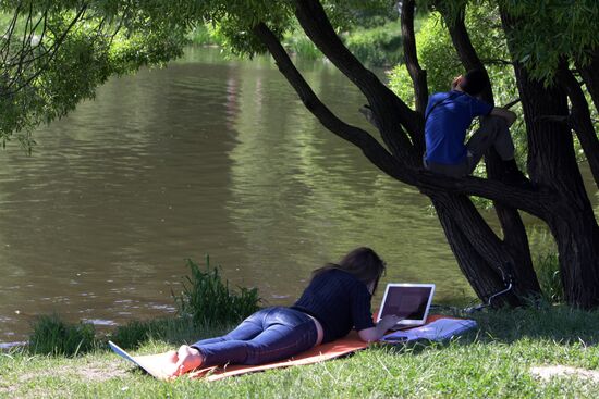 Muscovites resting outdoors