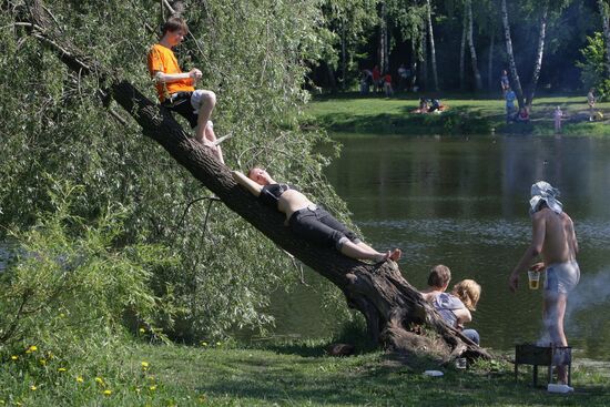 Muscovites resting outdoors