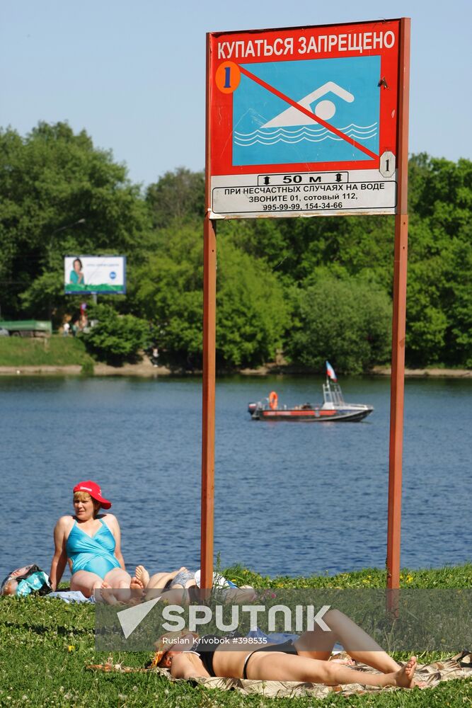 Muscovites resting outdoors