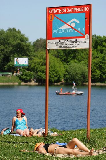 Muscovites resting outdoors