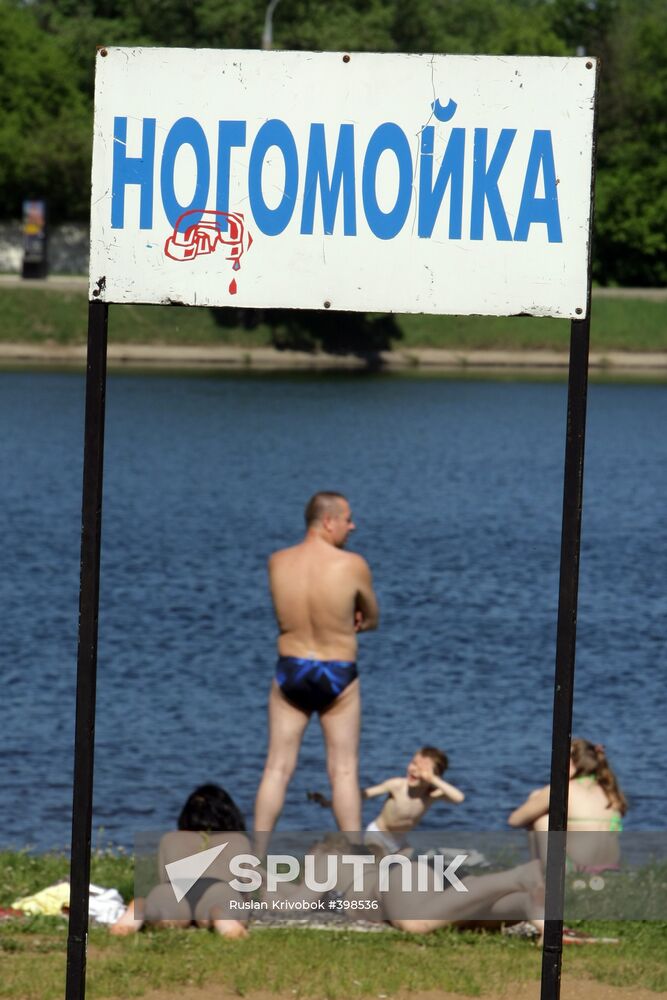 Muscovites resting outdoors