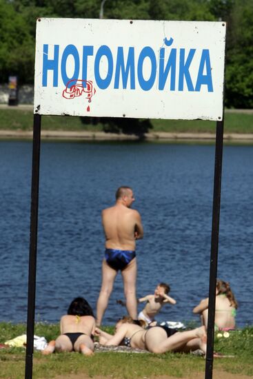 Muscovites resting outdoors