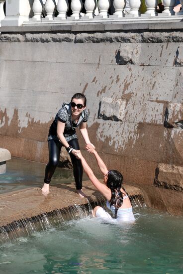 Young people swimming in downtown Moscow