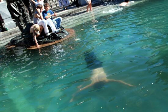 Young people swimming in downtown Moscow