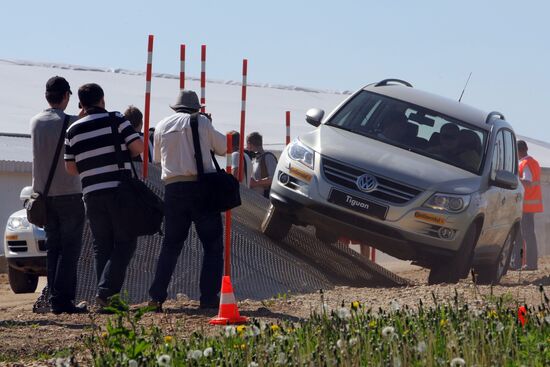 Participants test-drive Volkswagen SUVs outside Moscow