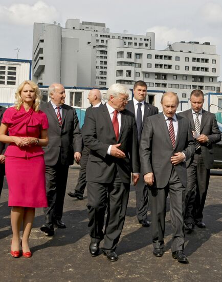 Vladimir Putin visits construction of children's clinic