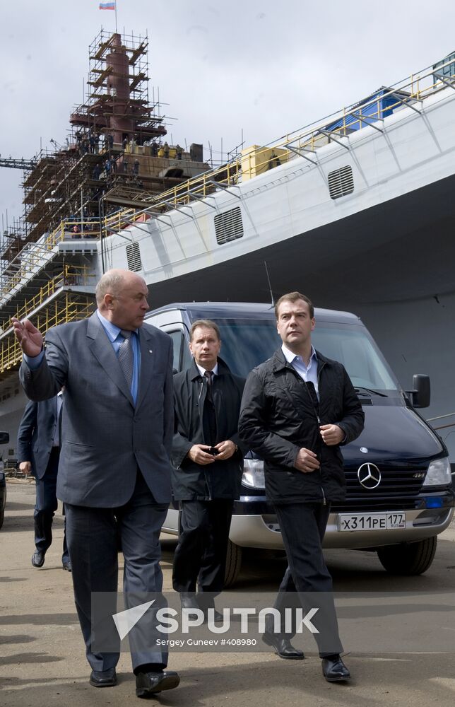 From right, foreground: President Dmitry Medvedev and Sevmash Director-General Nikolai Kalistratov visiting the Sevmash industrial association in Severodvinsk. Background: the aircraft-carrier "Admiral Gorshkov" being modernized by order from the Indian Navy. Location: Russia, Arkhangelsk region, Severodvynsk. Author: Sergey Guneev/Sputnik. President Dmitry Medvedev visits North Western Federal District