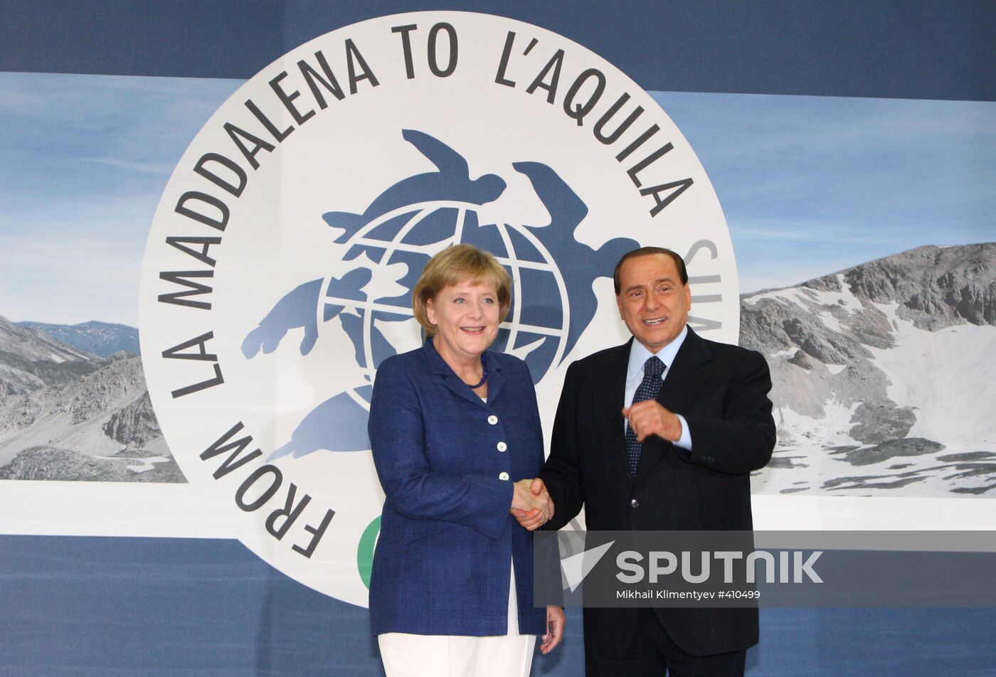 Angela Merkel, Silvio Berlusconi attend 2009 G8 summit