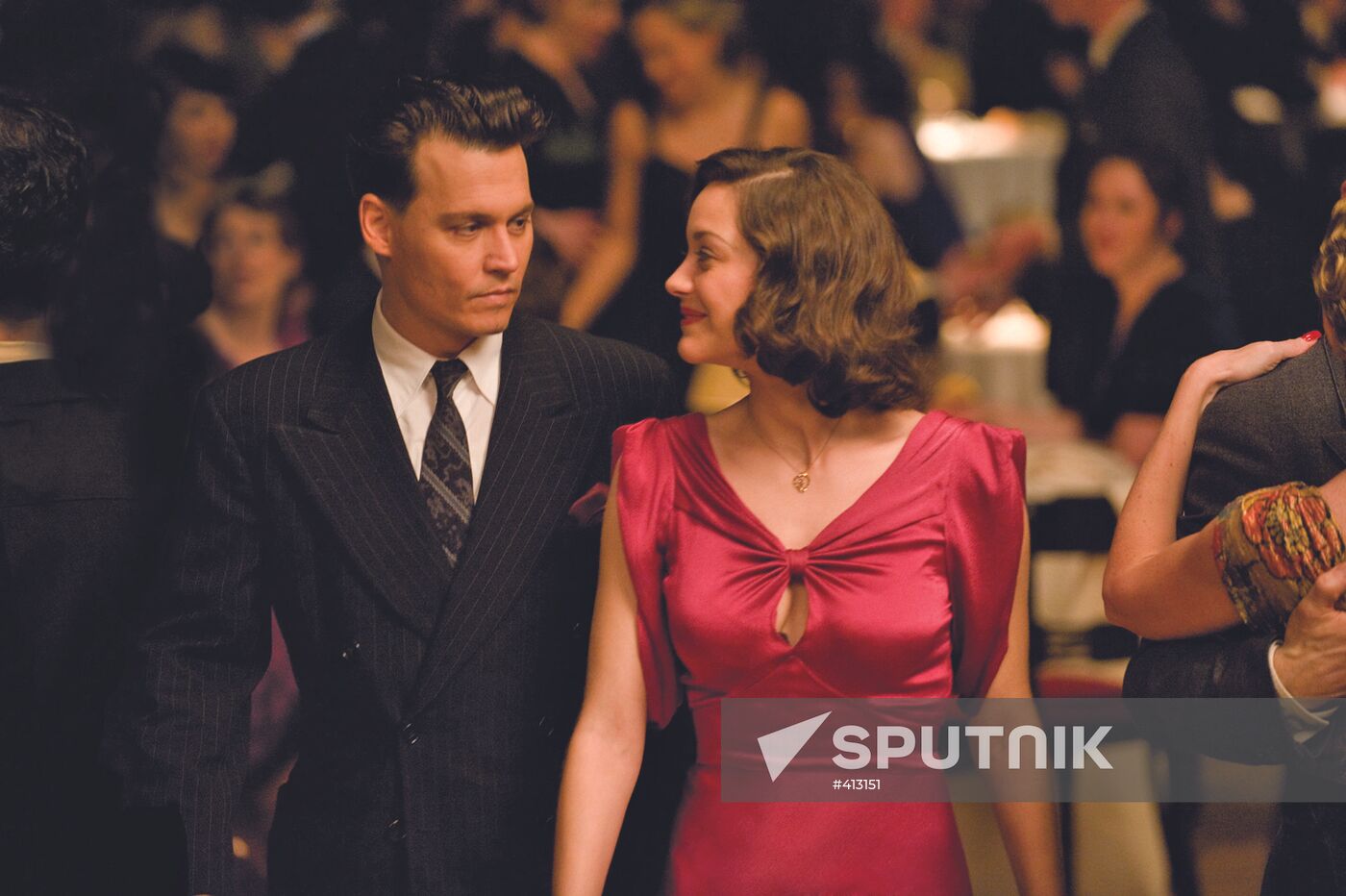 Johnny Depp and Marion Cotillard starring in Public Enemies