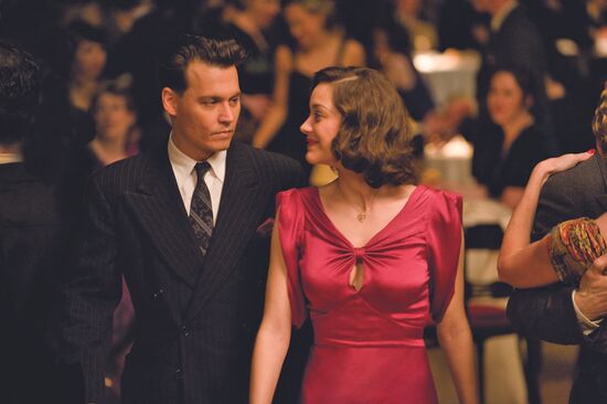 Johnny Depp and Marion Cotillard starring in Public Enemies