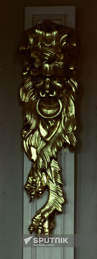 Gilded moulded lion mask