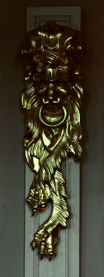 Gilded moulded lion mask