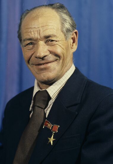 Tractor driver Ivan Ivanov of "New Road" Soviet farm