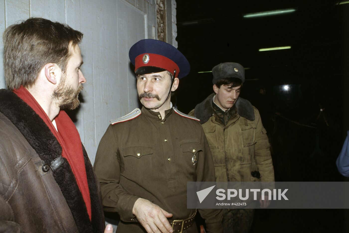 Artist Dmitry Belyukin talking to Cossack