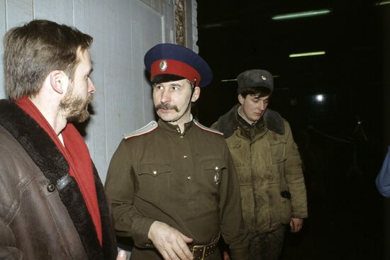 Artist Dmitry Belyukin talking to Cossack