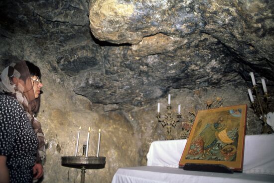 Russian pilgrims in St. John Baptist cave monastery in Holy Land